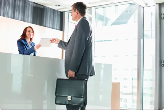 Hotel receptionist providing excellent customer service